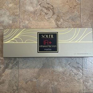 Brand new marble Soleil flat iron. Never used never taken out of the box.